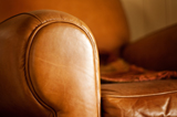closeup of warm tan leather armchair